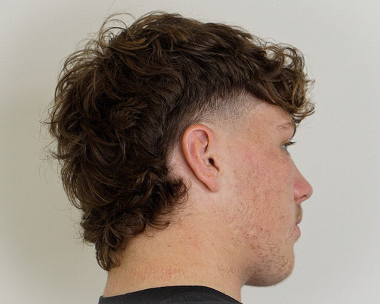 London's trending men's hairstyles 2025 - modern mullet and curtains with professional styling
